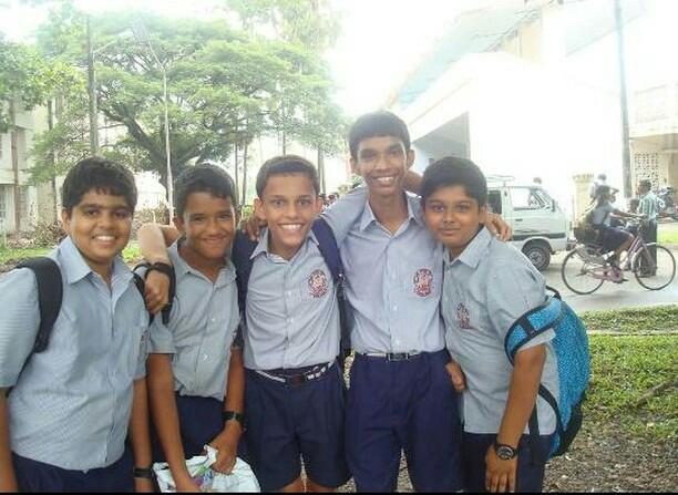 With school friends, in uniform